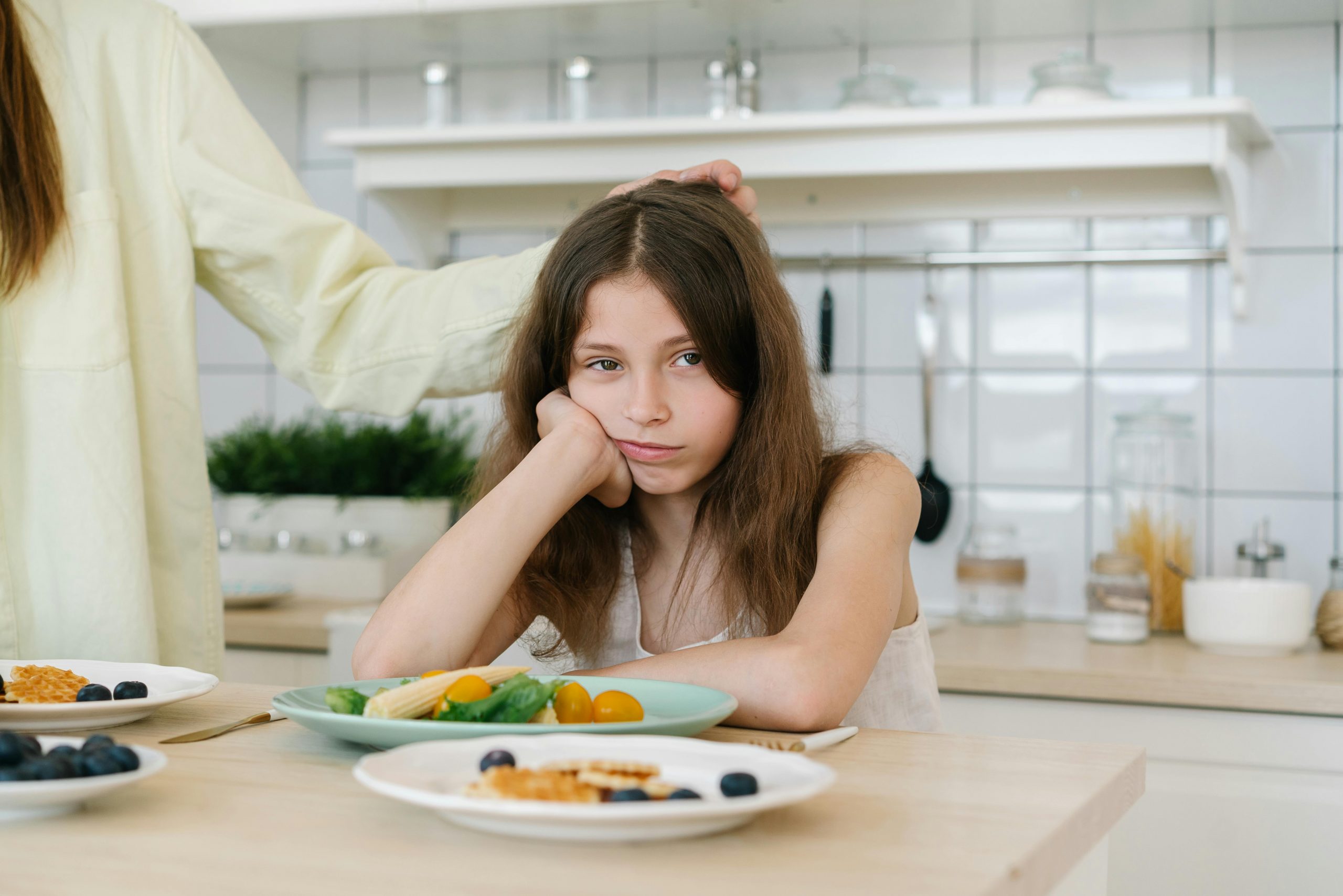 girl looking disappointed at her meal